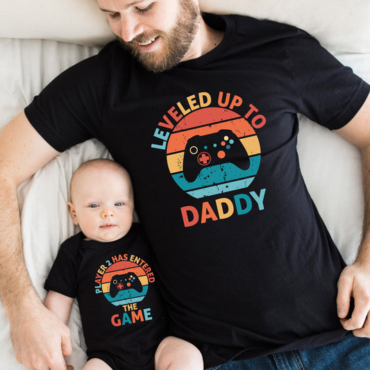 leveled up to daddy player 2 has entered the game black matching baby and daddy t-shirts shirts onesie